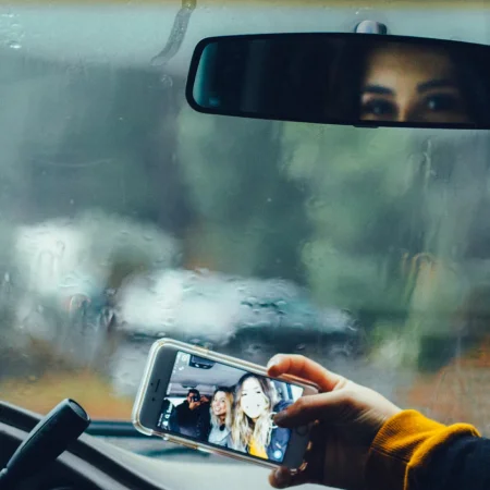 Person using Carol Rent app to book a car rental