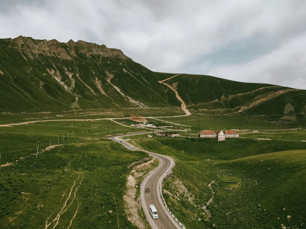 Aerial View of Highway Across Grassy Valley